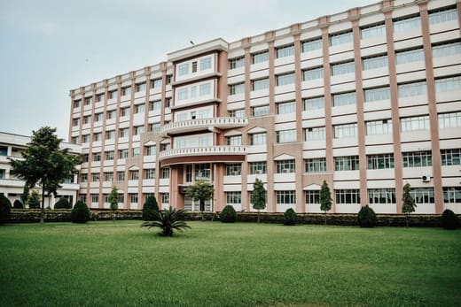 A university building across a wide lawn